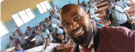 Head teacher at a school in Zambia takes a selfie with his students