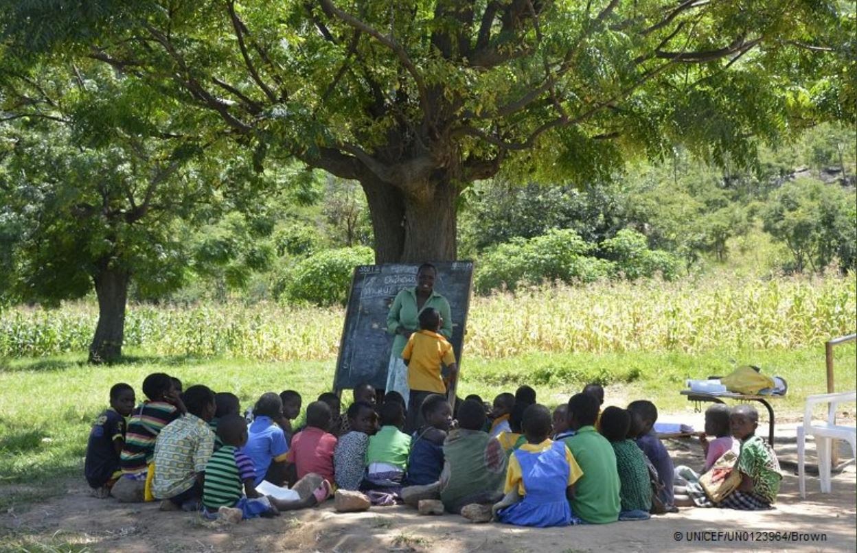 Malawi classroom under the trees.