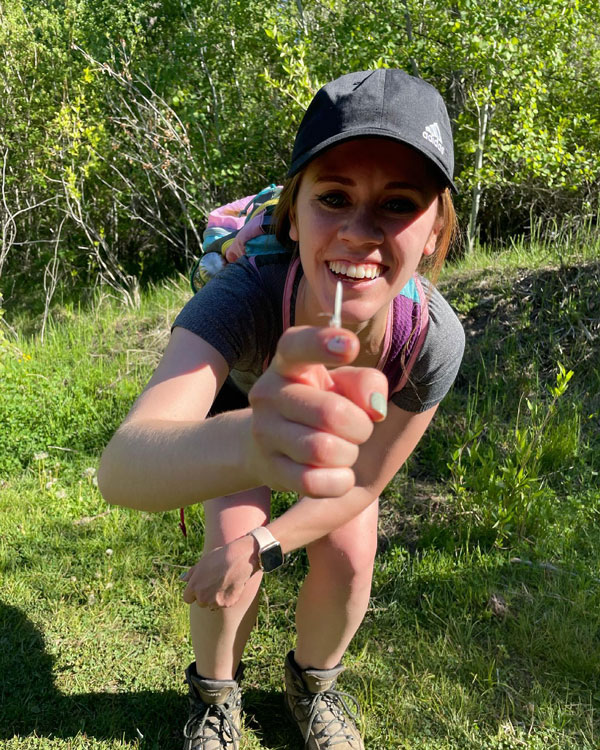 Rachel making friends with butterflies while out on a hike